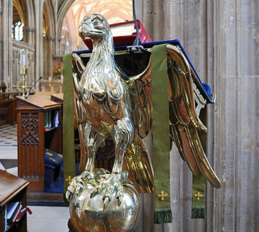 James Wathen gave this brass lectern to St Mary Redcliffe parish in Bristol. Sculpted lecterns were a key feature of churches from the medieval period into the early modern and demonstrated the wealth and status of the parish and its congregation. It was used to support books and the eagle as attribute of St John the Evangelist, author of the gospel of John, provided an appropriate symbol for the holy text. The sphere supporting this eagles feet has the inscription: This is the free gifte of James Wathen senior of this parish pinn maker. Anno Dmni 1638. Wathen was involved in the administration of the parish, first becoming churchwarden in 1638, so he may have given this gift to mark the beginning of this office. It is also a representation of his wider charitable acts: he employed poor boys of the parish in pinmaking and gifted twenty dozen loaves of bread to the poor in his will.<br />
<br />
This lectern is described as a free gift which is an important echo of sermons about charity like Robert Allens <em>The Oderifferous Garden of Charitie</em>, where he writes that a gift must be free and proceede of a liberall and franke mind (p.15) so that the giver does not expect anything in return. Wathen would nonetheless have increased his profile in the parish with such a significant and showy church object, which would have been visible to all his neighbours at Bible readings in the church.