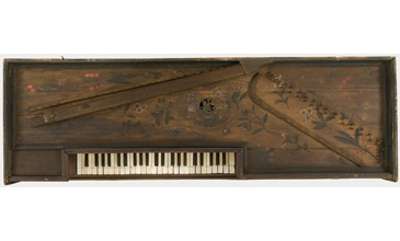 Virginals, or the virginal, is a keyboard instrument  a smaller and simpler form of harpsicord. Owning a virginal for entertainment at home was a sign of leisured social status. At this date, most virginals did not have a stand, but would be put on a table for use. This virginal was made in Antwerp and represents the kind of relatively plain imported examples that might be owned by select members of the middling sort. It is painted with flowers but is otherwise quite modestly decorated compared to those owned by elite members of society. It speaks to the entertainment function of the space and the sounds that would fill it. <br />
<br />
Heres what this kind of instrument sounds like: <a href='https://www.youtube.com/watch?v=-2ALV6XlVVI' target='_blank'>youtube.com/watch?v=-2ALV6XlVVI</a>