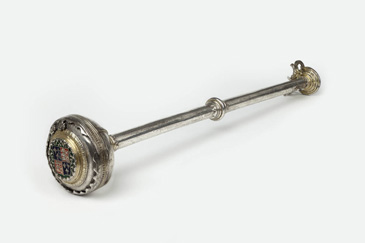 This mace was made for the Corporation of Stratford-upon-Avon in 1553, around the time the Corporation was founded. The Corporation was the governing body of Stratford-upon-Avon, much like a town council today. Many of the men serving on such councils were of middling status: people like William Shakespeares father, John Shakespeare. John was a glover, but he also served as bailiff (mayor) in 1568 and alderman before then. Maces were used to symbolise the power of the state, and many governing bodies had one. This mace has a long silver stem and a large silver bowl. The royal arms of Henry VIII decorate one end of the mace while the arms of the Corporation appear at the other, signifying the connection between the Corporation and the Crown. This connection was important to the reputation of the Corporation as their authority to govern came from the King himself. <br />
<br />
Maces were used on special, ceremonial occasions like pageants or feasts. They were looked after and carried by the sergeant-at-mace  a member of the Corporation who was responsible for ceremonial objects and occasions. These events in themselves were symbolic, put on to display the wealth, authority and tradition of the Corporation. Civic reputation was important for the whole town, as well as for the men who ran it. The Corporations reputation  how well they governed the town and handled its finances for instance  had a big impact on the infrastructure of the town, for instance trade and building. Ceremonial objects like this mace were public displays of the towns success. 