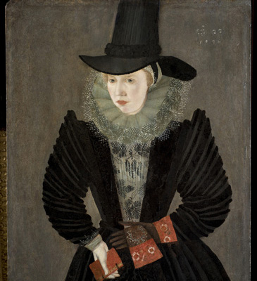 Portraiture was often used to shape and display ones reputation. Joan Alleyns portrait tells us that she was a wealthy, fashionable woman. Her clothes are at the height of Elizabethan trends and would have been made from the finest materialsclear from the lace fringing on her ruff.  As shaming rituals practised across England suggest, reputation was among the most important elements in maintaining a womans status.  However, it could sometimes be harder to craft, as it was so often linked to a husband or other male relatives.  It also walked a tightrope between respectability and showiness or immodesty.<br />
<br />
Through this portrait, Joan is able to display her own wealth, taste, authority, marriage and religion  all things that contributed to a good reputation.  We can read these status symbols via the material details on display.  Joans outfit is that of a member of the urban elite, similar to those worn by the wives of London citizens (as distinguished from women of the royal court). The tall hat, large ruff (collar), padded sleeves and strong stance give her a sense of importance. In her right hand, she holds a book, likely a prayer book to signify her religious piety. She wears one glove on her left hand and holds the other. Gloves this fine would not have been worn during activities like manual work or horse riding, they could only be worn by wealthy women who had other people do these tasks for them.<br />
<br />
This portrait is dated 1596, four years after Joans marriage to wealthy theatre actor, Edward Alleyn. This union was happy and profitable for both Joan and Edward, who became extremely wealthy through his business partnership with his father-in-law, theatre entrepreneur Philip Henslowe. Joan herself undertook many of the London business dealings while her husband was away on theatrical tour.